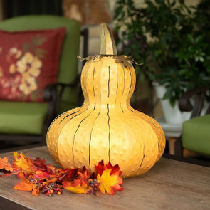 Yellow Gourd Luminary on endtable with chair in background