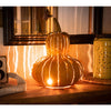 Yellow Gourd Luminary, lit, on kitchen counter