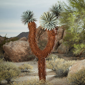 Steel Joshua Tree with desert background