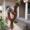 Three Arm Joshua Tree in landscape bed next to porch