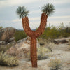 Steel Joshua Tree with desert background