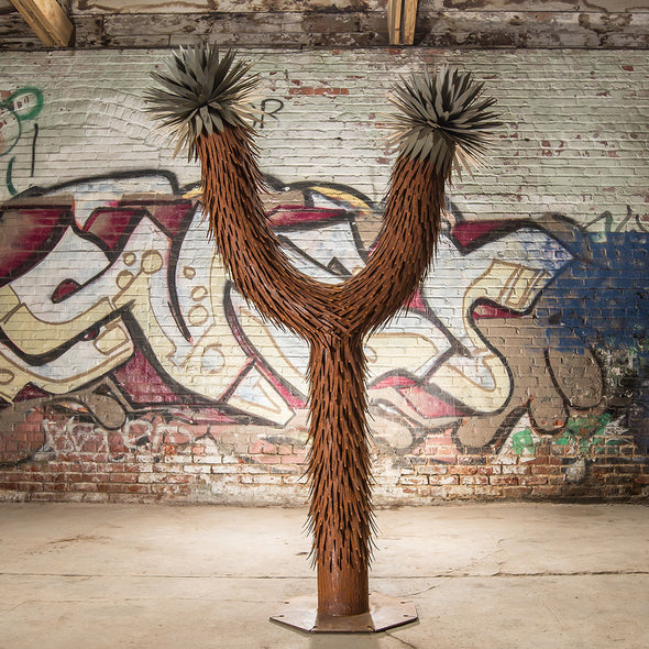 Steel Joshua Tree with grafitti background