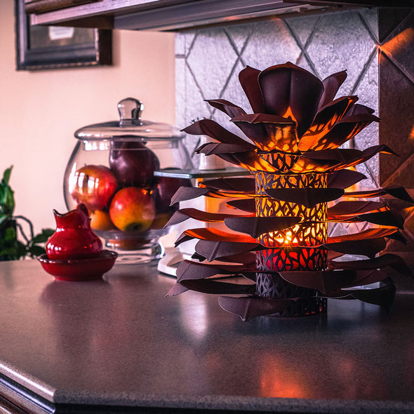 Pinecone Luminary lit up on kitchen counter