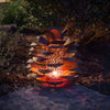 Pine Cone Luminary lit up on porch