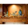 Prickly Pear Mantel Sculpture with accent lighting above fireplace