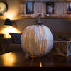 White Squatty Pumpkin Luminary lit in interior scene